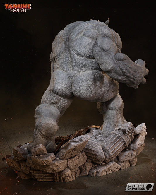 Rear view of Rhino collectible statue showing full muscular back, tailbone detail, and smashed base filled with debris and shattered columns.
