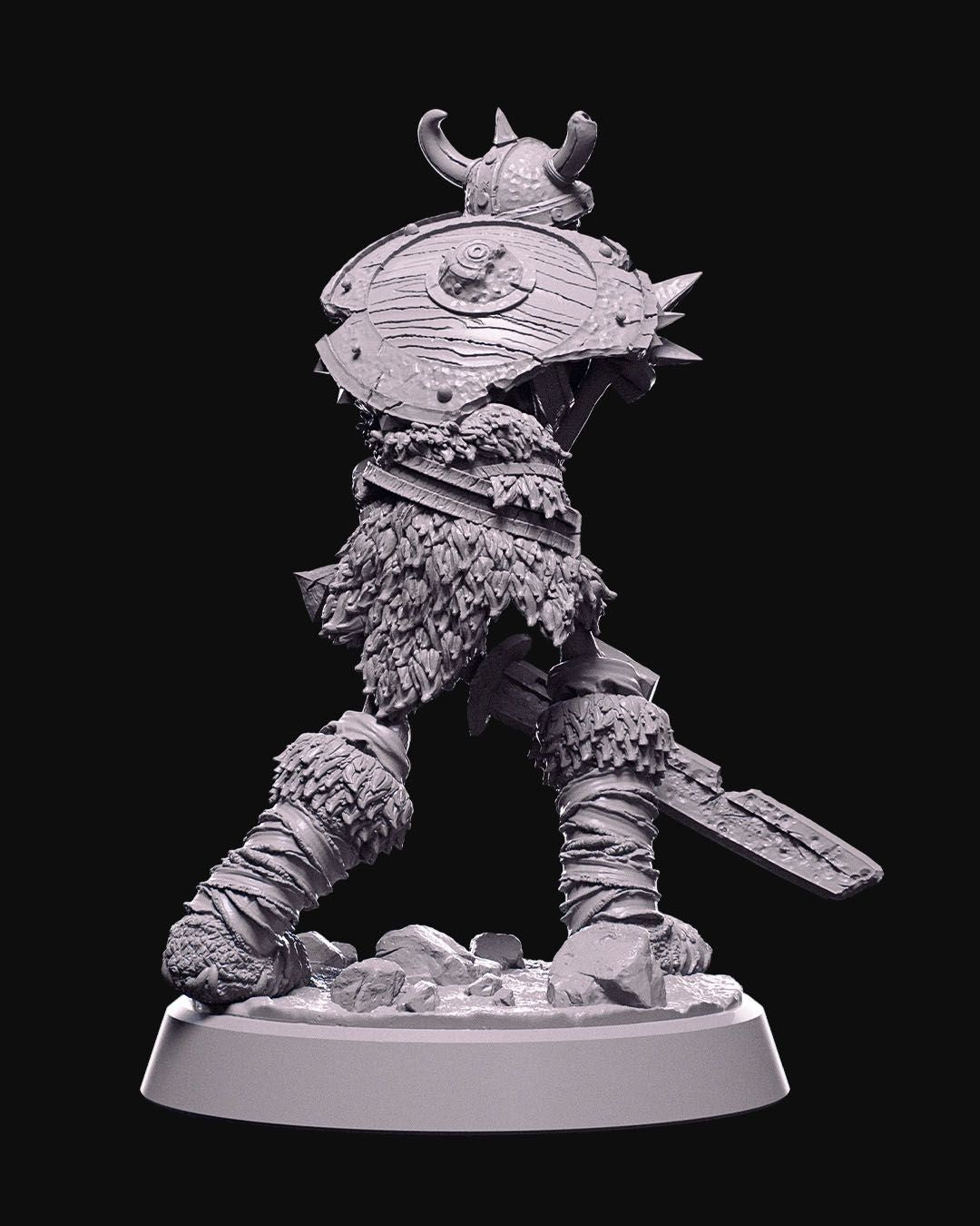 Front and back views of the Skeletal Warrior miniature, an undead figure with a horned helmet, heavy sword, and a rugged spiked shield, detailed with ragged armor and bandaged legs.