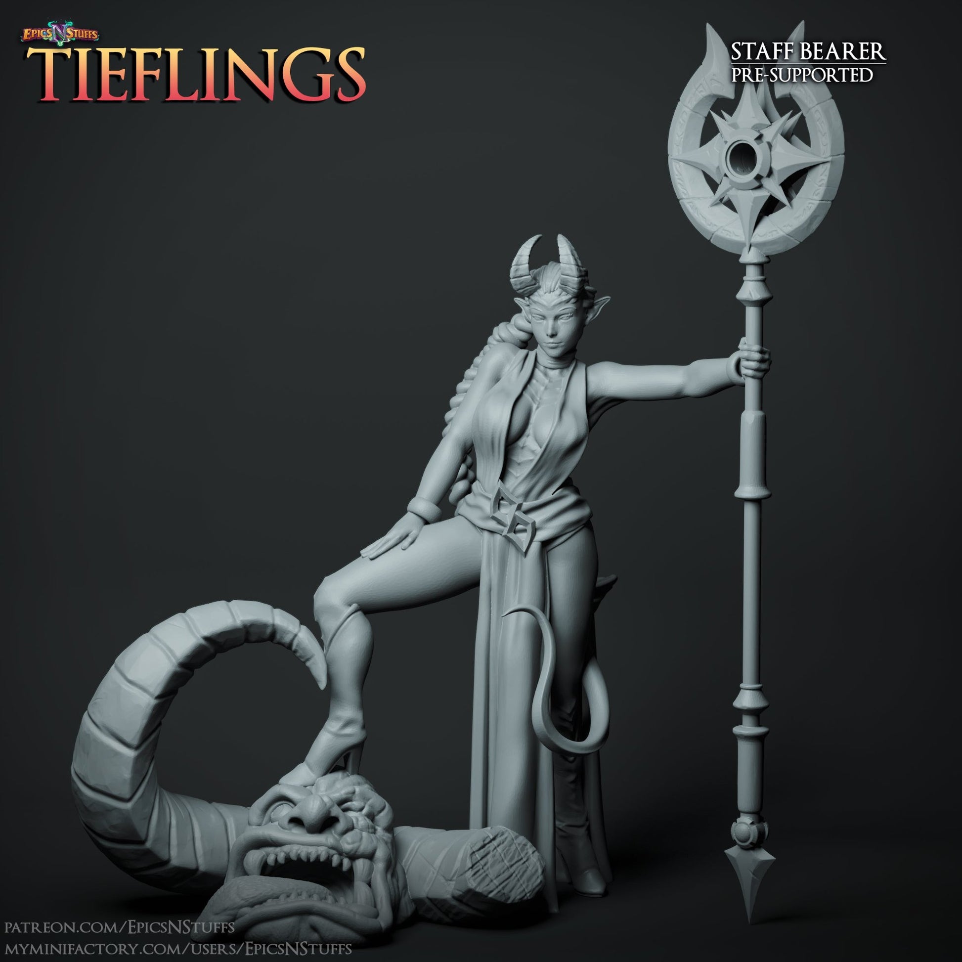 A Tiefling Staff Bearer miniature with a commanding pose, one foot on a demonic head and holding a large, intricate staff. She has horns, a tail, and is dressed in flowing attire, perfect for a spellcaster or warlock role in TTRPGs.