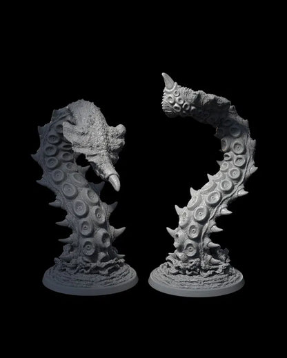 Two Kraken tentacle miniatures, rising from the sea with intricate suction cup details.