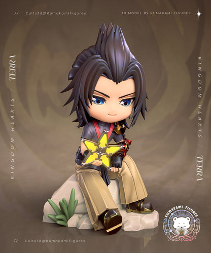 Chibi Terra Kingdom Hearts figure seated on a rock holding a Wayfinder charm, stylized chibi proportions with spiked hair, armored gauntlet, layered outfit, and relaxed pose on a rocky base