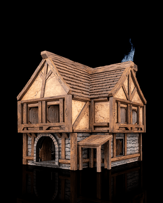 Angled view of the Gilded Flagon Tavern miniature building showing the arched doorway, side awning, timber structure, and chimney with rising smoke.