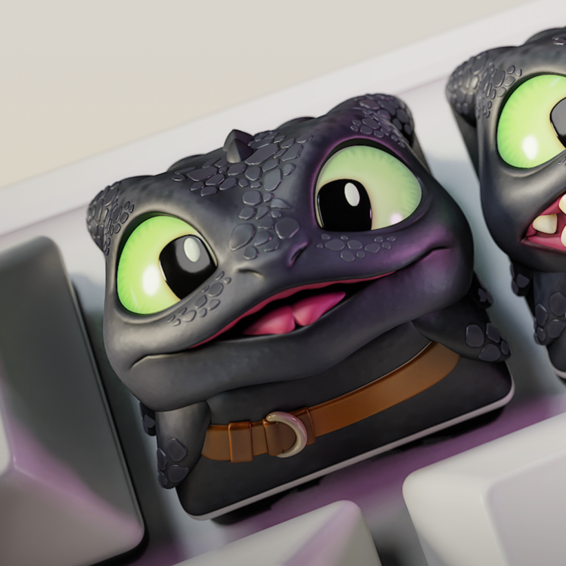 Three cartoonish keycaps with a character design on a keyboard