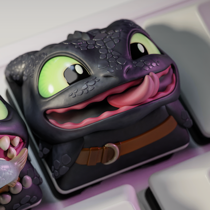 Three cartoonish keycaps with a character design on a keyboard