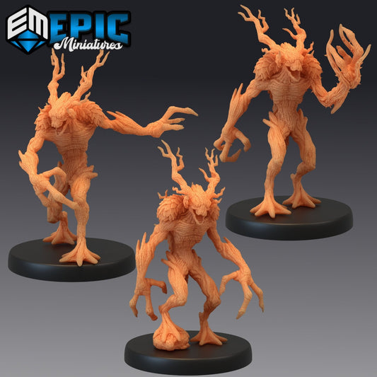 Three Twig Blight miniatures, each posed with branch-like limbs and twisted bodies.