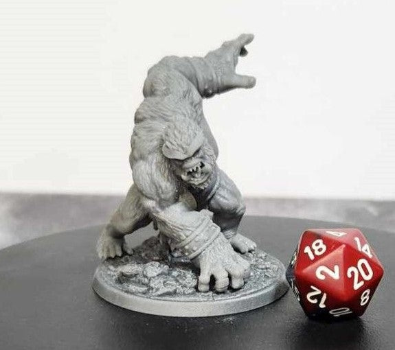 Detailed Demon Brute Miniature for Dungeons and Dragons, Pathfinder, Warhammer, and other tabletop games shown with a D20 die for scale.