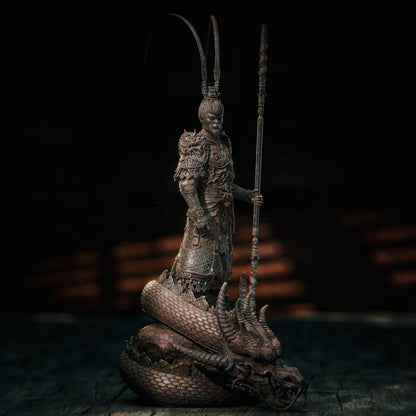 Full view of Wukong holding his staff, dressed in elaborately detailed armor, standing heroically on a dragon base.