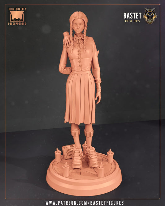 Unpainted full figure of Wednesday Addams posed with Thing’s hand on her shoulder atop candle base.