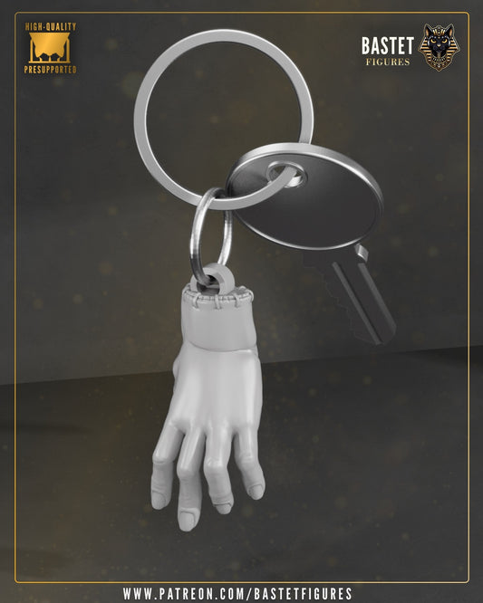 Thing keychain accessory shaped like a severed hand attached to a metal keyring.