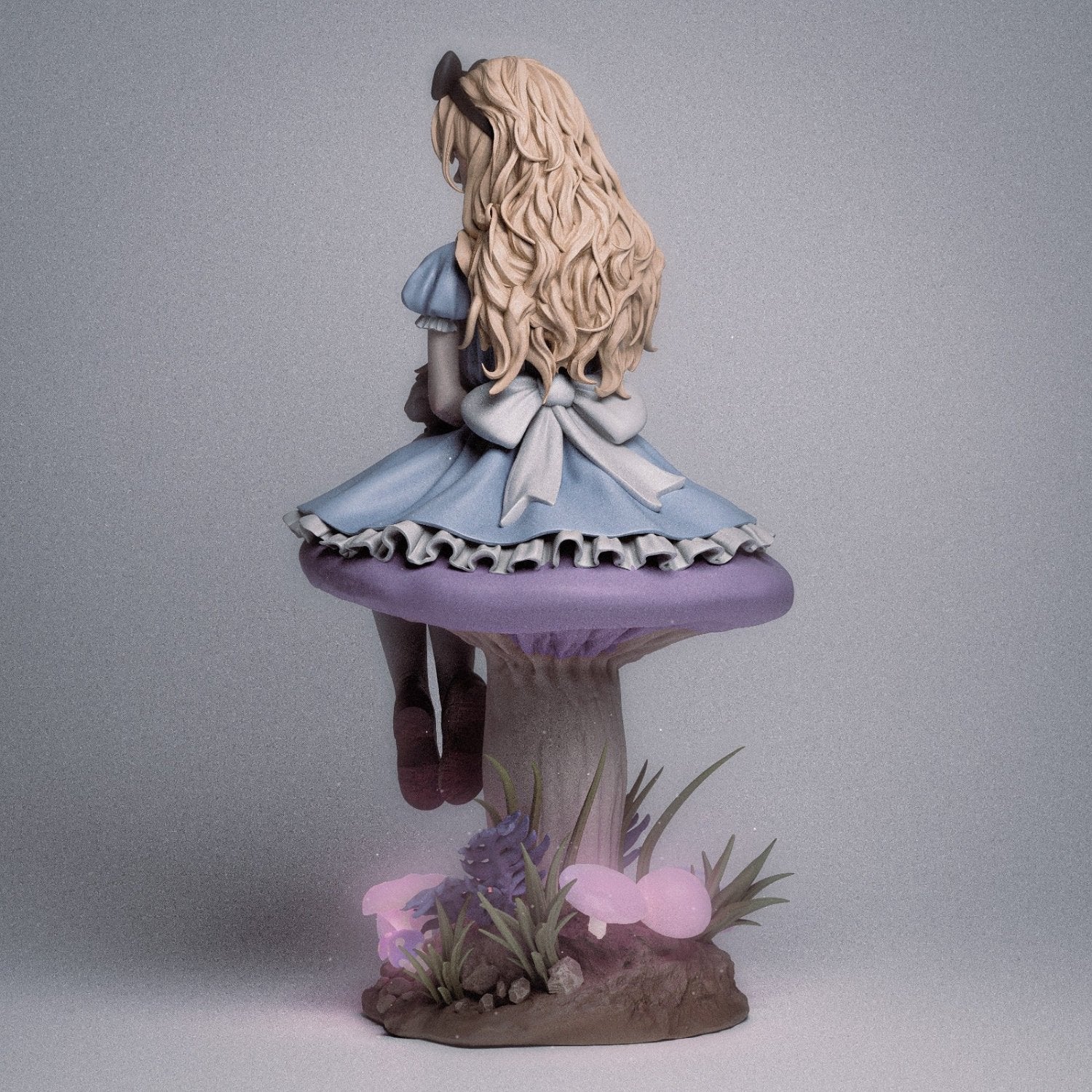 Back view of Alice on a mushroom, showing her long flowing hair.