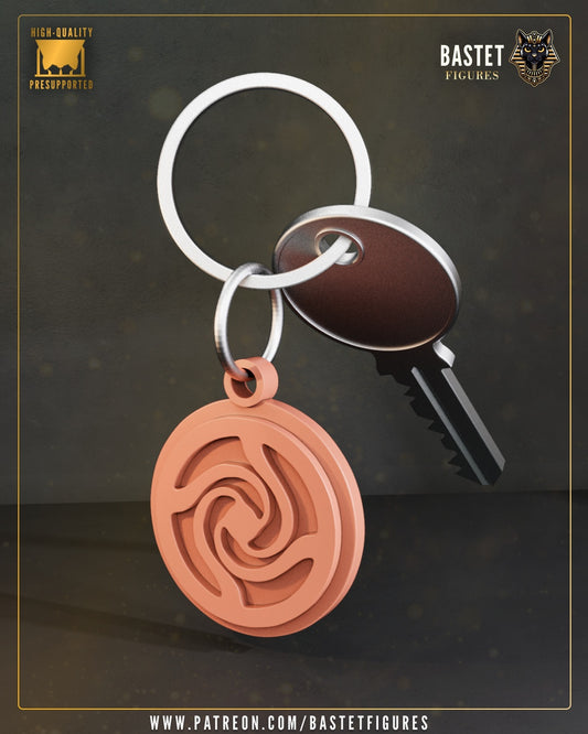 Yuta emblem keychain featuring spiral curse mark design attached to a metal key ring and silver key, inspired by Jujutsu Kaisen anime.