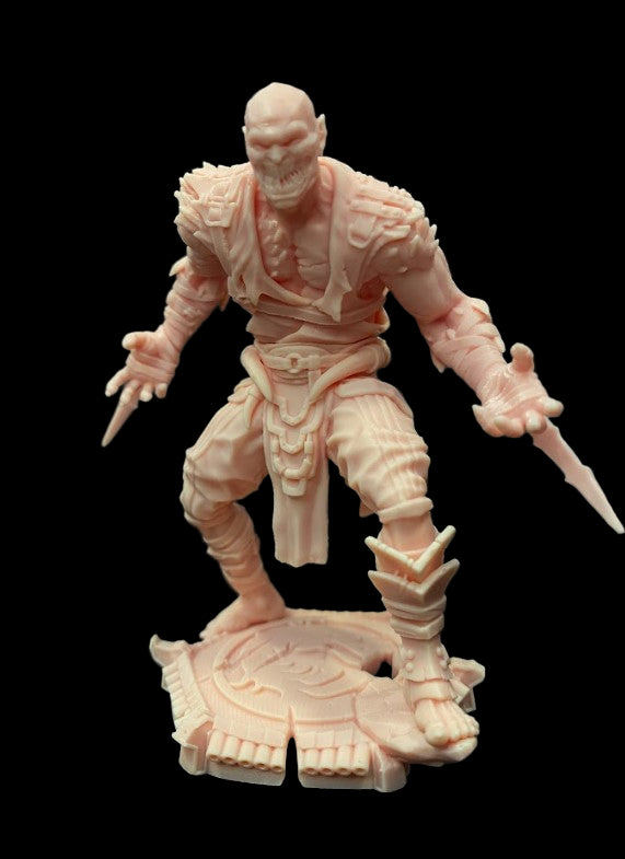 Resin Print Image – Melted Assassin resin miniature fully assembled, showcasing muscular form, arm blades, and grimacing face.