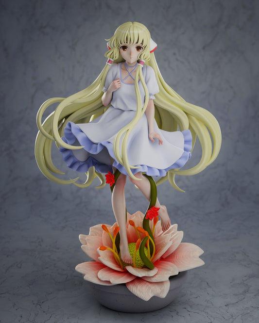 Full front view of Chi figure standing on a lotus base with flowing hair and frilly dress – Chobits anime 1:7 scale collectible.