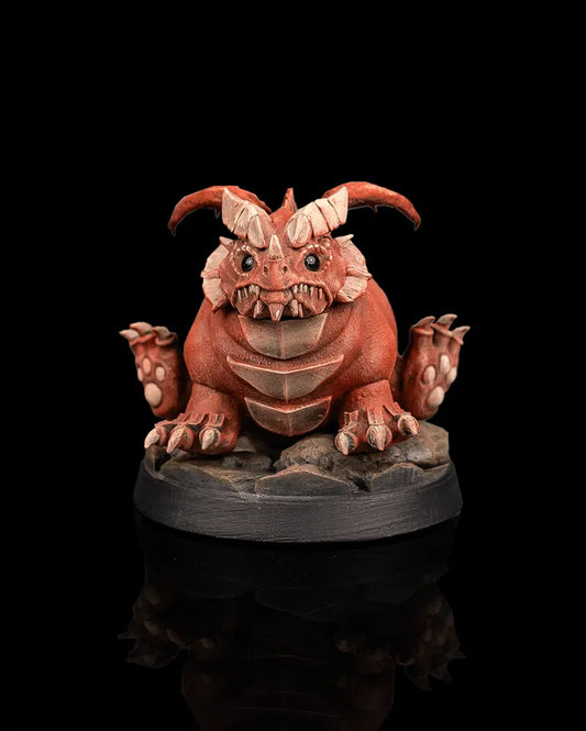 Young red dragon creature miniature front view from Beldrad's Bag of Beasts with chubby body, curled horns, stubby wings, seated pose, and exaggerated proportions inspired by Themberchaud from Dungeons & Dragons Honor Among Thieves