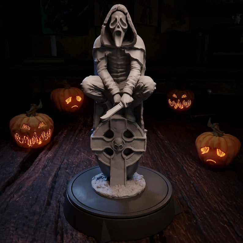 Hunter miniature featuring a hooded figure and a ghost mask, crouching on a tombstone with a knife in hand.