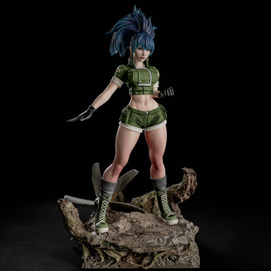Front view of Leona Heidern 1:6 scale collectible figure from The King of Fighters, standing on a battlefield base with one hand raised and wearing a green tactical uniform, gloves, and boots.