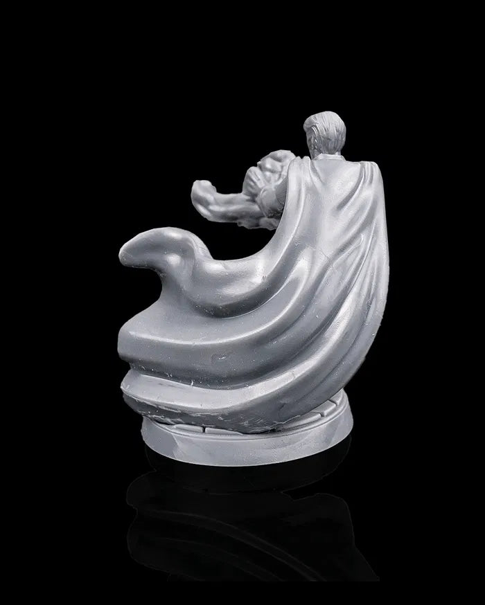 Human sorcerer hero miniature rear view from Beldrad's Bag of Beasts showing sweeping cloak, forward momentum pose, layered garments, and cinematic spellcasting posture for tabletop roleplaying games