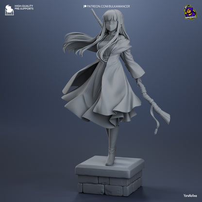 Front grayscale view of Fern statue in mid-step pose with cloak billowing and staff in hand.
