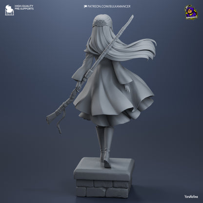 Rear grayscale view of Fern statue showing wind-swept cloak and detailed staff carried behind her.