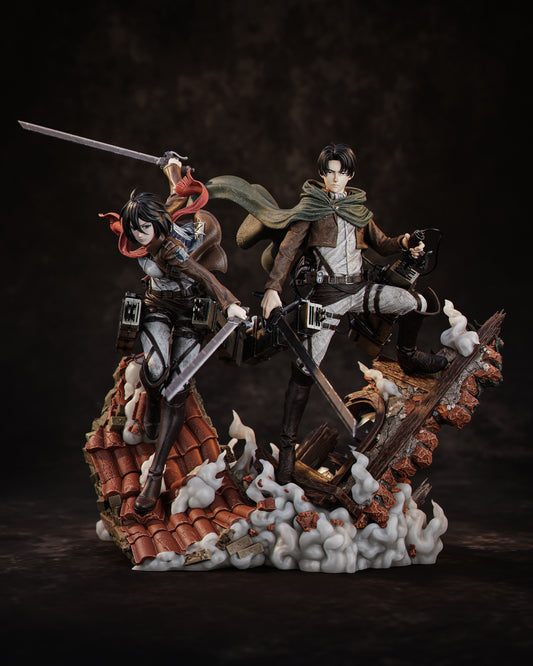 Mikasa Ackerman and Levi Ackerman 1:6 scale diorama from Attack on Titan showing both characters mid-air with swords drawn, ODM gear deployed, and rooftop debris base