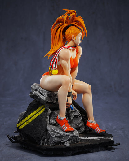 Side view of Captain Mizuki collectible showing medals draped over her shoulder, muscular physique, and dynamic anime styling.