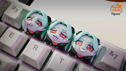 Wide shot of the full mechanical keyboard featuring Rebecca’s keycaps in the top row among standard keys, with visible NomNom branding.