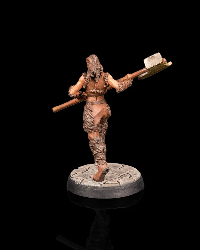 Human barbarian hero miniature rear view from Beldrad's Bag of Beasts showing powerful stride, fur-trimmed clothing, raised hammer, and dynamic combat posture for tabletop roleplaying games