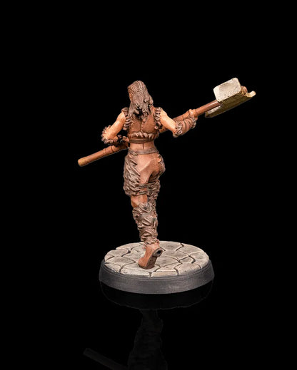 Human barbarian hero miniature rear view from Beldrad's Bag of Beasts showing powerful stride, fur-trimmed clothing, raised hammer, and dynamic combat posture for tabletop roleplaying games