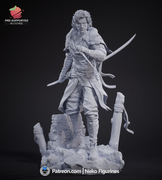Frontal view of the fully assembled unpainted Verso figure from Expedition 33, showcasing his dual swords, fur cloak, and scenic base.